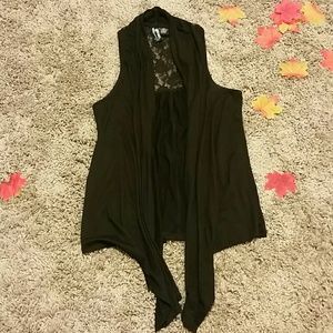 Asymmetrical vest with lace cutout at back